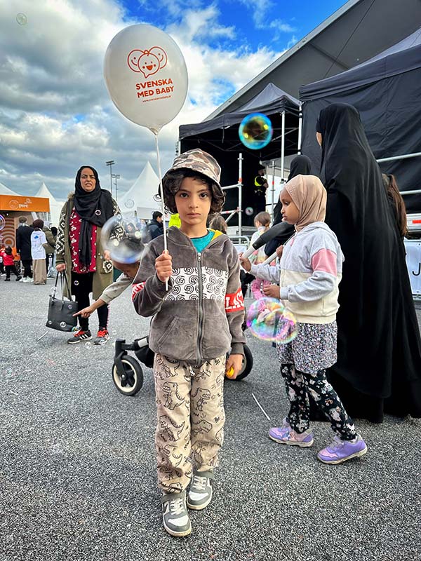 Boy with family on activity Saturday.